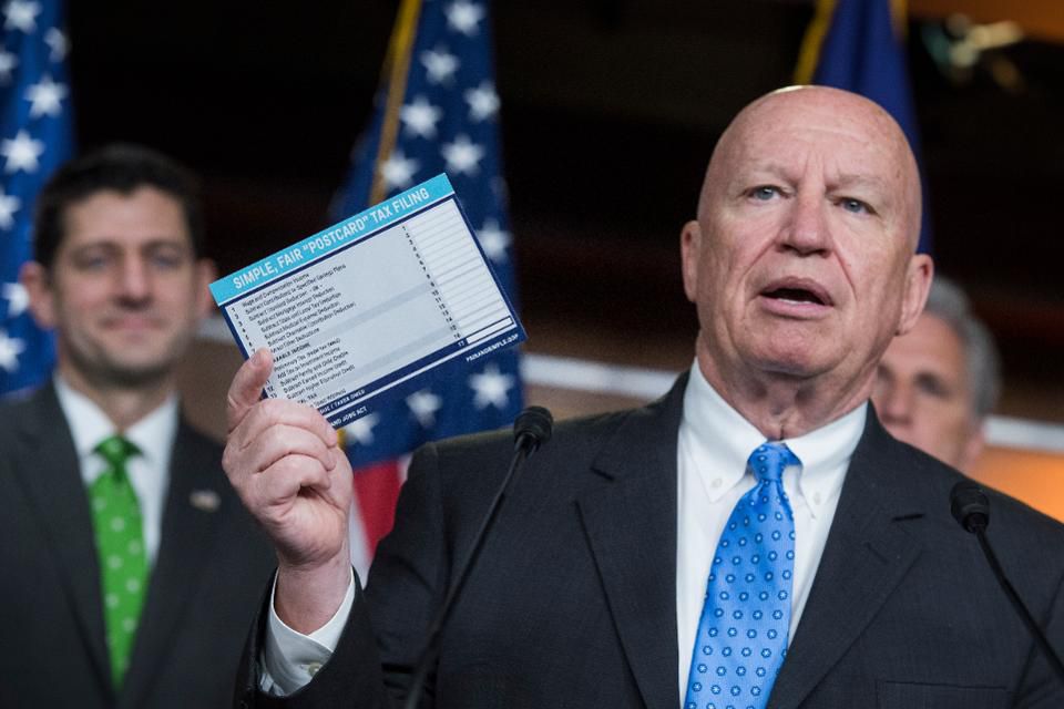 Last April, then House Ways and Means Chairman Rep. Kevin Brady, R-Texas, displayed a sample of a postcard-style tax filing as an example of the GOP tax overhaul's simplification. But there's nothing simply about new Section 199A.  (Photo by Tom Williams/CQ Roll Call)